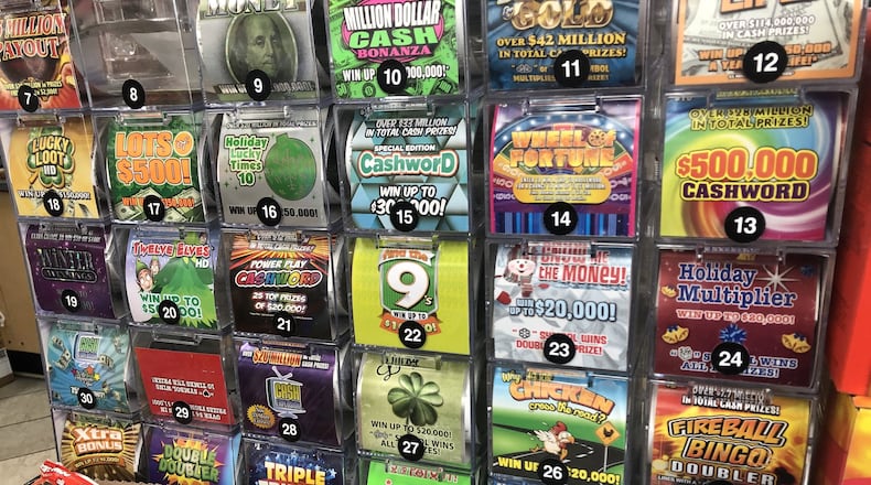 The Ohio Lottery offers a variety of holiday- and winter-themed scratch-off games. Lottery sales increase in Greene, Miami and Montgomery counties during the holiday season. CORNELIUS FROLIK / STAFF