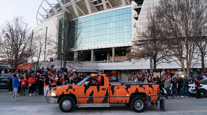 Fans wait outside Paul Brown Stadium for the arrival of the Cincinnati Bengals, who were returing home from their NFL football Super Bowl 56 loss to the Los Angeles Rams, Monday, Feb. 14, 2022, in Cincinnati. (AP Photo/Jeff Dean)