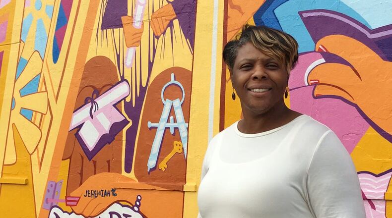 Yvette Kelly-Fields, executive director, The Wesley Community Center. Wesley, which was founded 50 years ago in response to the 1966 riot, added this mural of a community rebuilding this summer. JOSH SWEIGART / STAFF