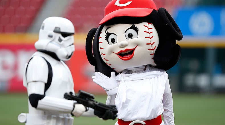 CINCINNATI, OH - MAY 15: Cincinnati Reds mascot Rosie Red waves to a Star Wars character on the field before the game against the San Francisco Giants at Great American Ball Park on May 15, 2015 in Cincinnati, Ohio. (Photo by Joe Robbins/Getty Images)