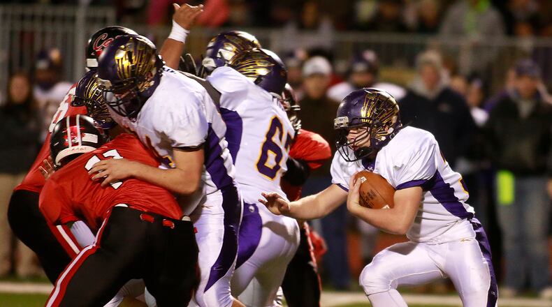 Mechanicsburg’s Dustin Knapp looks for a hole to carry the ball through against Jefferson. Bill Lackey/Staff