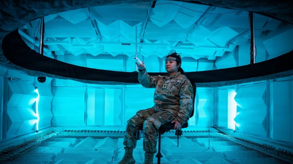 Second Lt. Hailey Ramos, human factors engineer, wears a motion capture headset as she identifies the direction of sound emitted from a circular array of speakers in the Spatial Hearing Anechoic Research Chamber Lab at Wright-Patterson Air Force Base, Sept. 11, 2025. Air Force photo/ Richard Eldridge