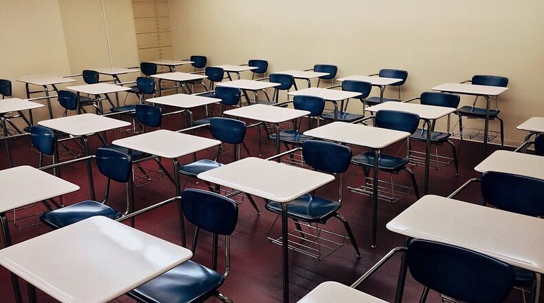 Students at a Florida high school had their portraits blown up poster size, and they straddled the driveway leading up to the main campus. (Wokandapix/Pixabay)