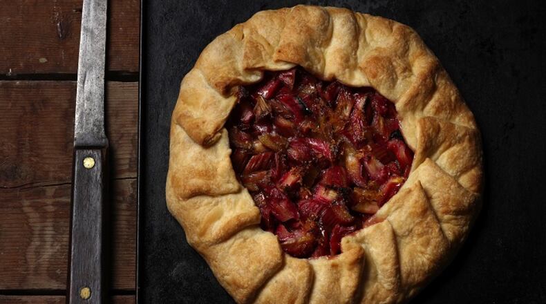 The tart filling is a simple combination of rhubarb, sugar and lemon, topped with dots of butter. The rustic tart is equally easy, requiring no fussy crimping or fitting into a pan. (styled by Joan Moravek) (E. Jason Wambsgans/Chicago Tribune/TNS)