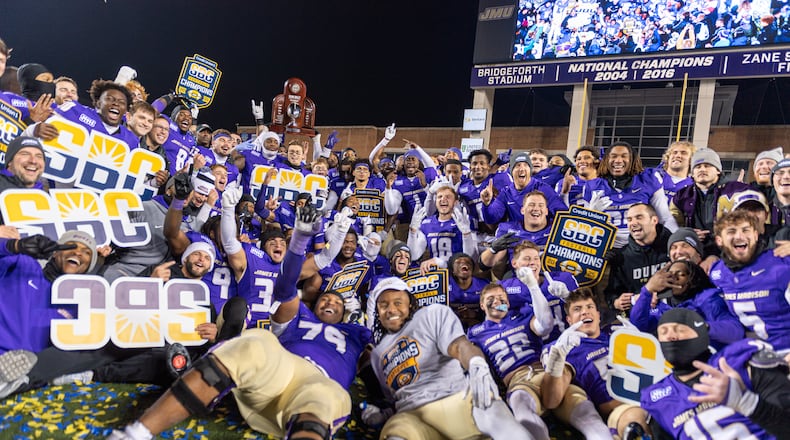 James Madison team celebrates after winning the Sun Belt championship NCAA college football game against Troy, Friday, Dec. 5, 2025, in Harrisonburg, Va. (AP Photo/Robert Simmons)