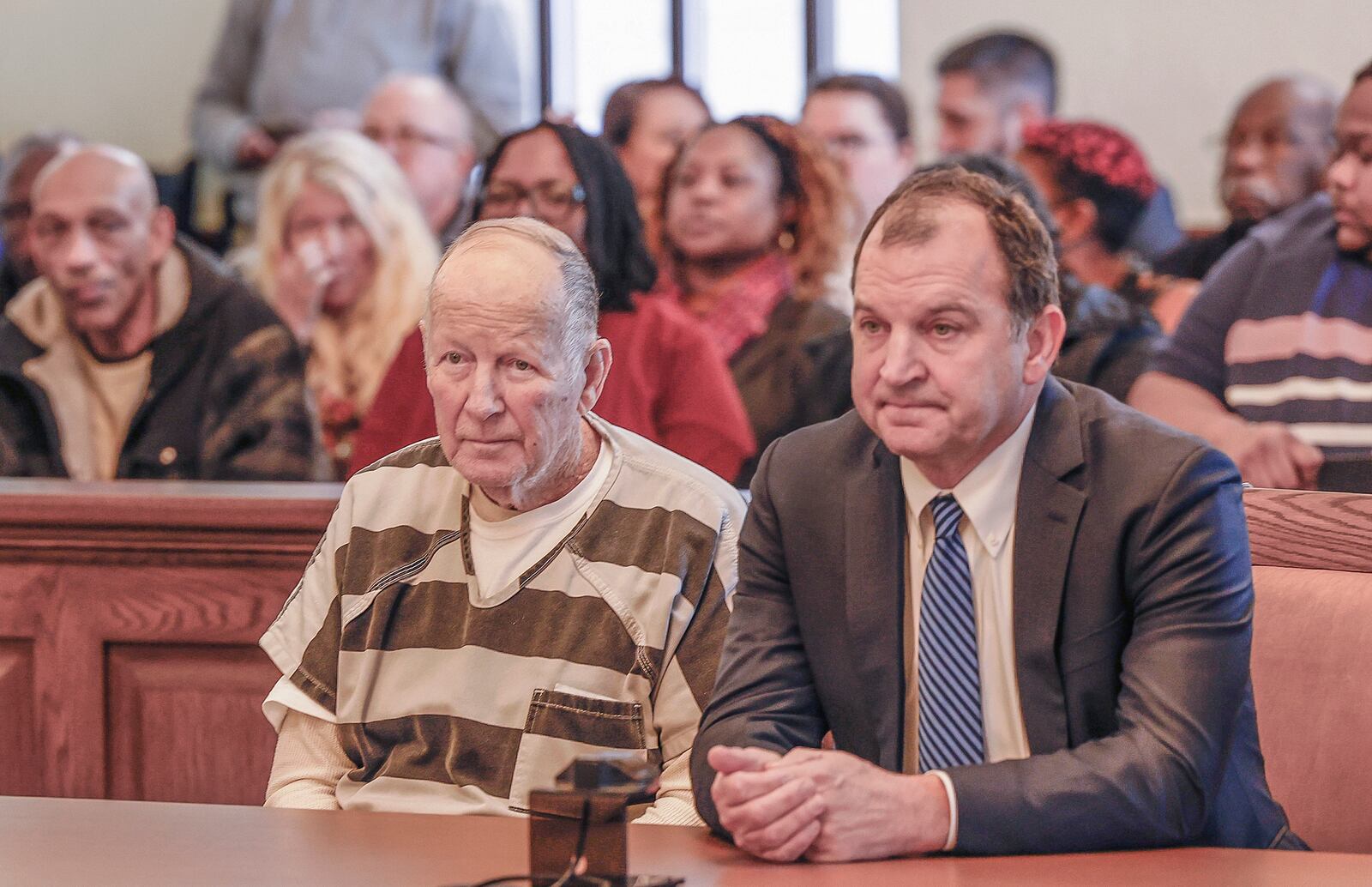 William Brock, left, and his defendant attorney Jon Paul Rion listen as a judge speaks at Brock's sentencing at the Clark County Common Pleas Court on Friday, Jan. 30, 2025, in Springfield. The 83-year-old was convicted of shooting Hall, a 61-year-old Uber driver, in March 2024 because he reportedly believed she was trying to rob him after scammers deceived them. JOSEPH COOKE/STAFF