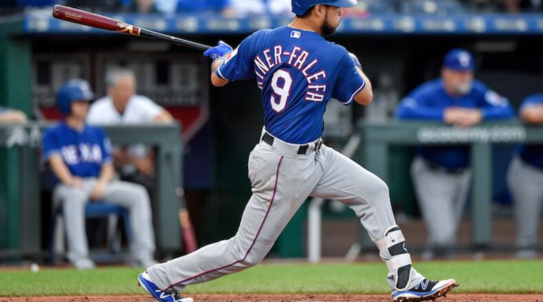The Texas Rangers' Isiah Kiner-Falefa follows through on an RBI double to score Adrian Beltre in the third inning against the Kansas City Royals at Kauffman Stadium in Kansas City, Mo., on Tuesday, June 19, 2018. (John Sleezer/Kansas City Star/TNS)