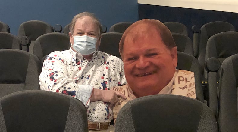 Doug Sorrell, one of the Plaza Theatre emeritus board of directors, is the first cardboard cutout that will help ensure social distancing in the Miamisburg theatre. CONTRIBUTED PHOTO