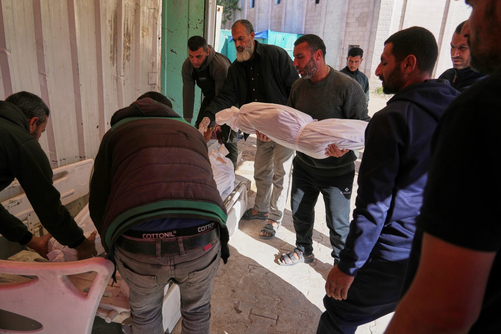 Palestinians prepare for burial the bodies of several members of the al-Atal family, killed in an Israeli airstrike on a tent in the Jabalia refugee camp, at the Indonesian hospital in Beit Lahia, northern Gaza Strip, Thursday, April 17, 2025.(AP Photo/(AP Photo/Jehad Alshrafi)
