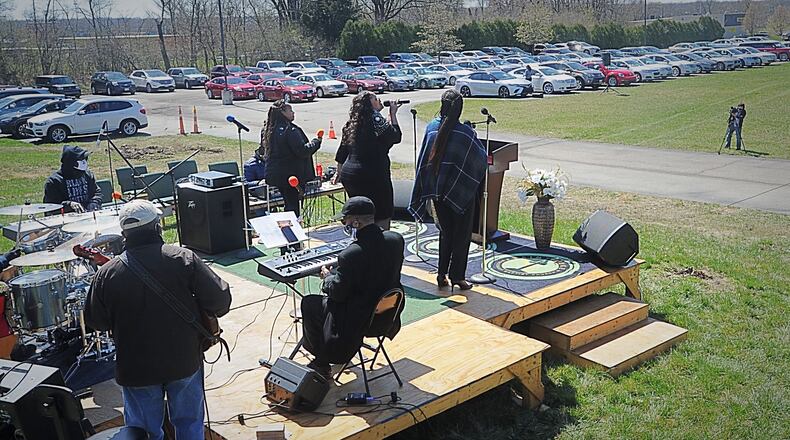 St. Luke Missionary Baptist Church hosted a drive-in multi-racial, multi-denominational outdoor worship service on Good Friday to help bring the Miami Valley community together in worship and song while marking the death of Jesus on the cross. MARSHALL GORBY\STAFF