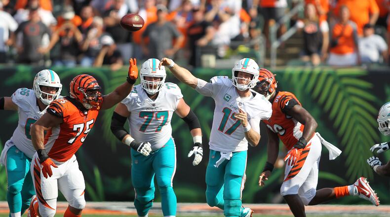 CINCINNATI, OH - OCTOBER 7:  Ryan Tannehill #17 of the Miami Dolphins throws a pass over Jordan Willis #75 of the Cincinnati Bengals during the fourth quarter at Paul Brown Stadium on October 7, 2018 in Cincinnati, Ohio. Cincinnati defeated Miami 27-17. (Photo by John Grieshop/Getty Images)