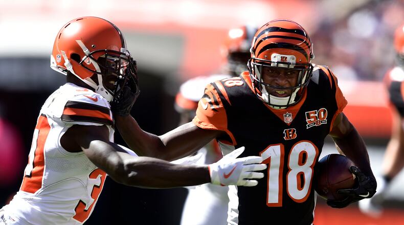 Cincinnati Bengals wide receiver A.J. Green (18) runs against Cleveland Browns defensive back Jason McCourty (30) in the first half of an NFL football game, Sunday, Oct. 1, 2017, in Cleveland. Cincinnati won 31-7. (AP Photo/David Richard)