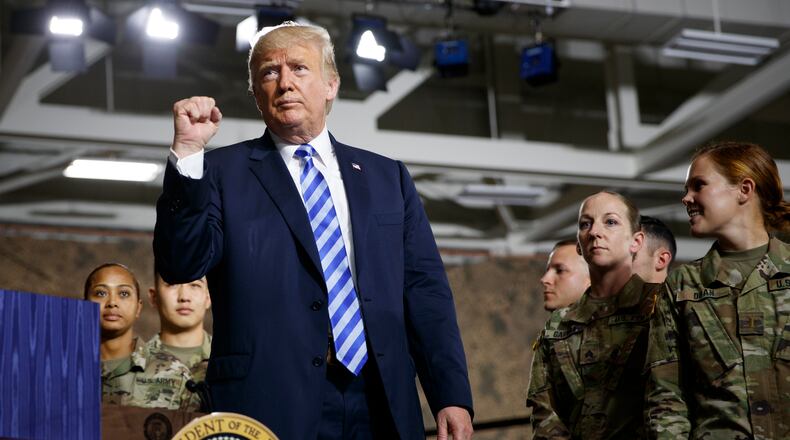 President Donald Trump delivers remarks during the signing ceremony for the John S. McCain National Defense Authorization Act at Wheeler-Sack Army Air Field in Fort Drum, N.Y., August 13, 2018. The president is later headlining a fundraiser for Rep. Claudia Tenney (R-N.Y.) in Utica. (Tom Brenner/The New York Times)