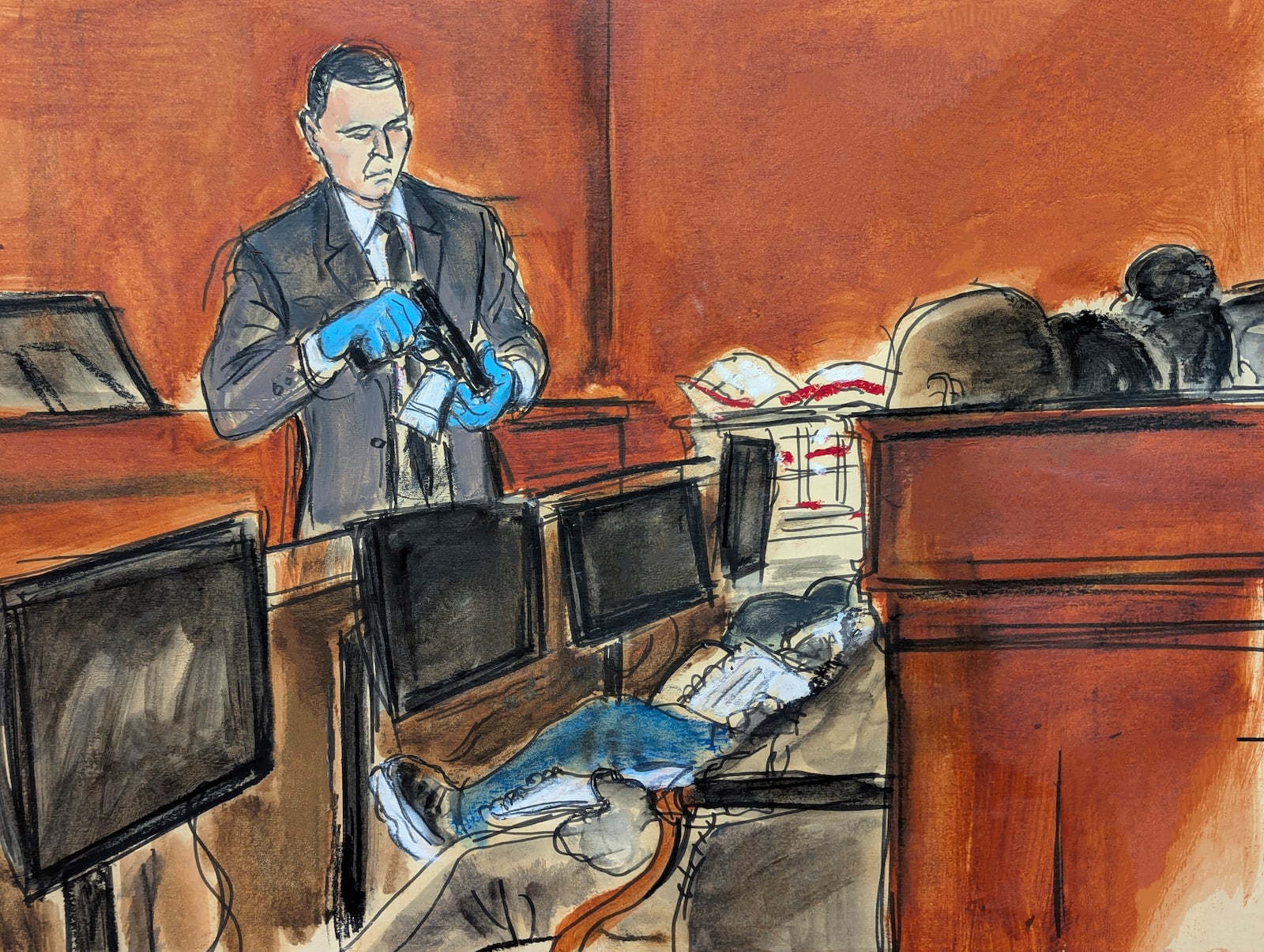 Special agent Gerard Gannon shows the jury a hand gun recovered from Sean "Diddy" Combs' Star Island residence during Combs' sex trafficking and racketeering trial in Manhattan federal court, Wednesday, May 21, 2025, in New York. (Elizabeth Williams via AP)