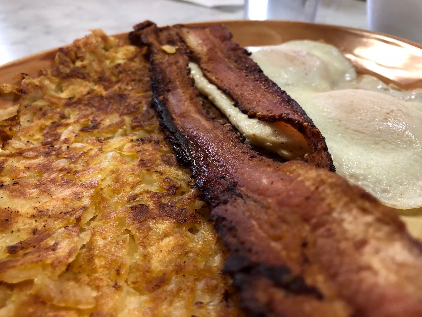 Grips Grill and Diner is located at  15 Springfield St. in Dayton. Part of the  Get a Grip  - two eggs, hash browns,  meat, and biscuit and gravy - is pictured.