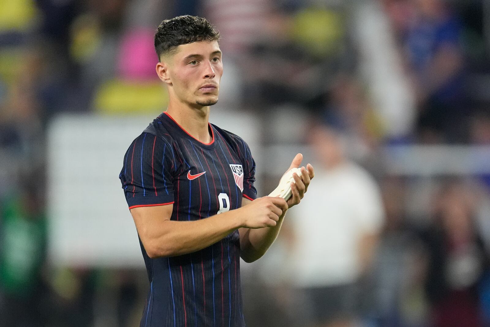 United States defender Sebastian Berhalter (8) looks to the bleachers after the team's loss in an international friendly soccer match against the Switzerland, Tuesday, June 10, 2025, in Nashville, Tenn. (AP Photo/George Walker IV)