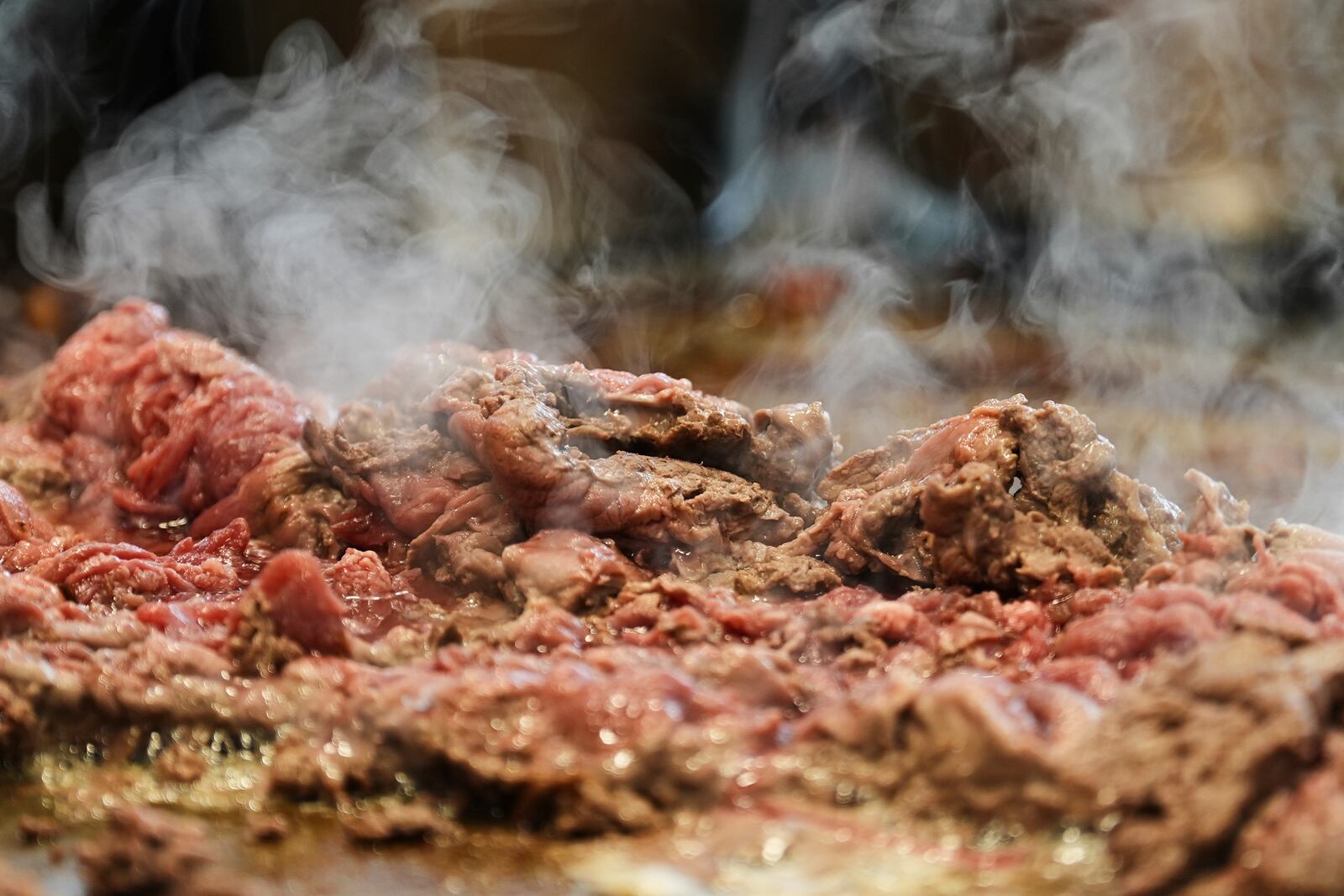 Beef slices for cheesesteaks are being cooked at Jim's South St. in Philadelphia, Wednesday, July 23, 2025. (AP Photo/Matt Rourke)