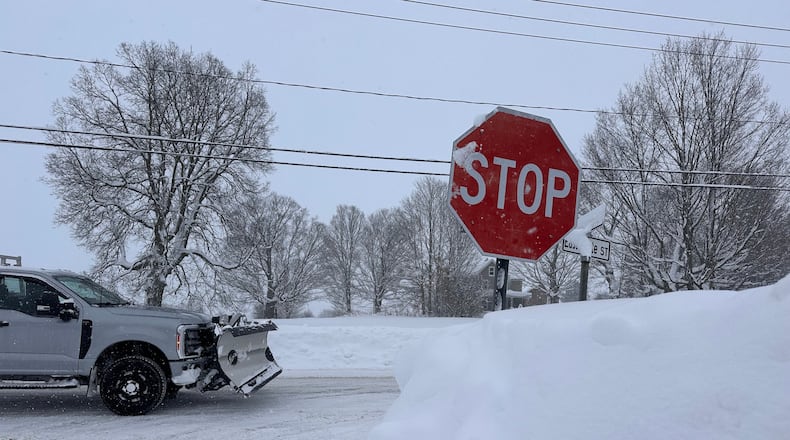 A driver navigates fresh snowfall in Lowville, New York, on Friday, Jan. 23, 2026. (AP Photo/Cara Anna)