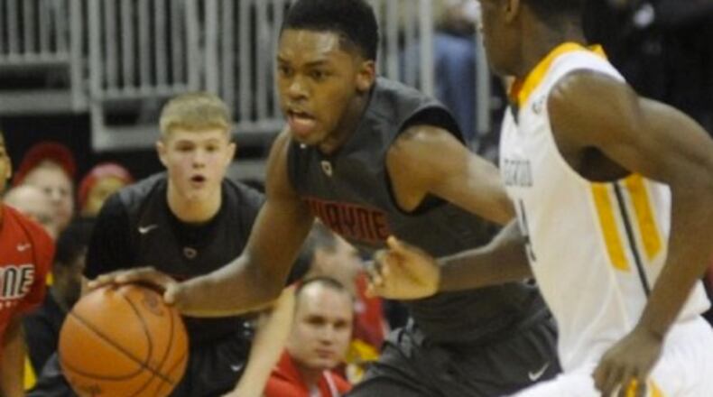 Wayne’s Trey Landers, left, races up court in a state semifinal game against Lakewood St. Edward at OSU’s Schottenstein Center on Friday, March 27, 2015. Marc Pendleton/Staff
