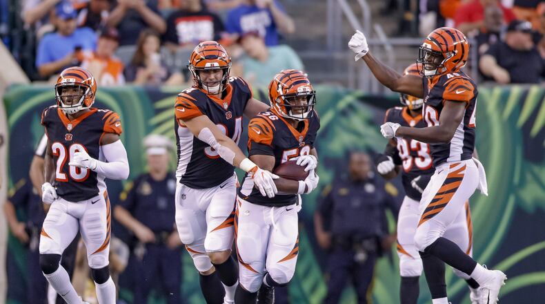 CINCINNATI, OH - AUGUST 30: Carl Lawson #58 of the Cincinnati Bengals celebrates a fumble recovery during the first half of a preseason game against the Indianapolis Colts at Paul Brown Stadium on August 30, 2018 in Cincinnati, Ohio. (Photo by Michael Hickey/Getty Images)