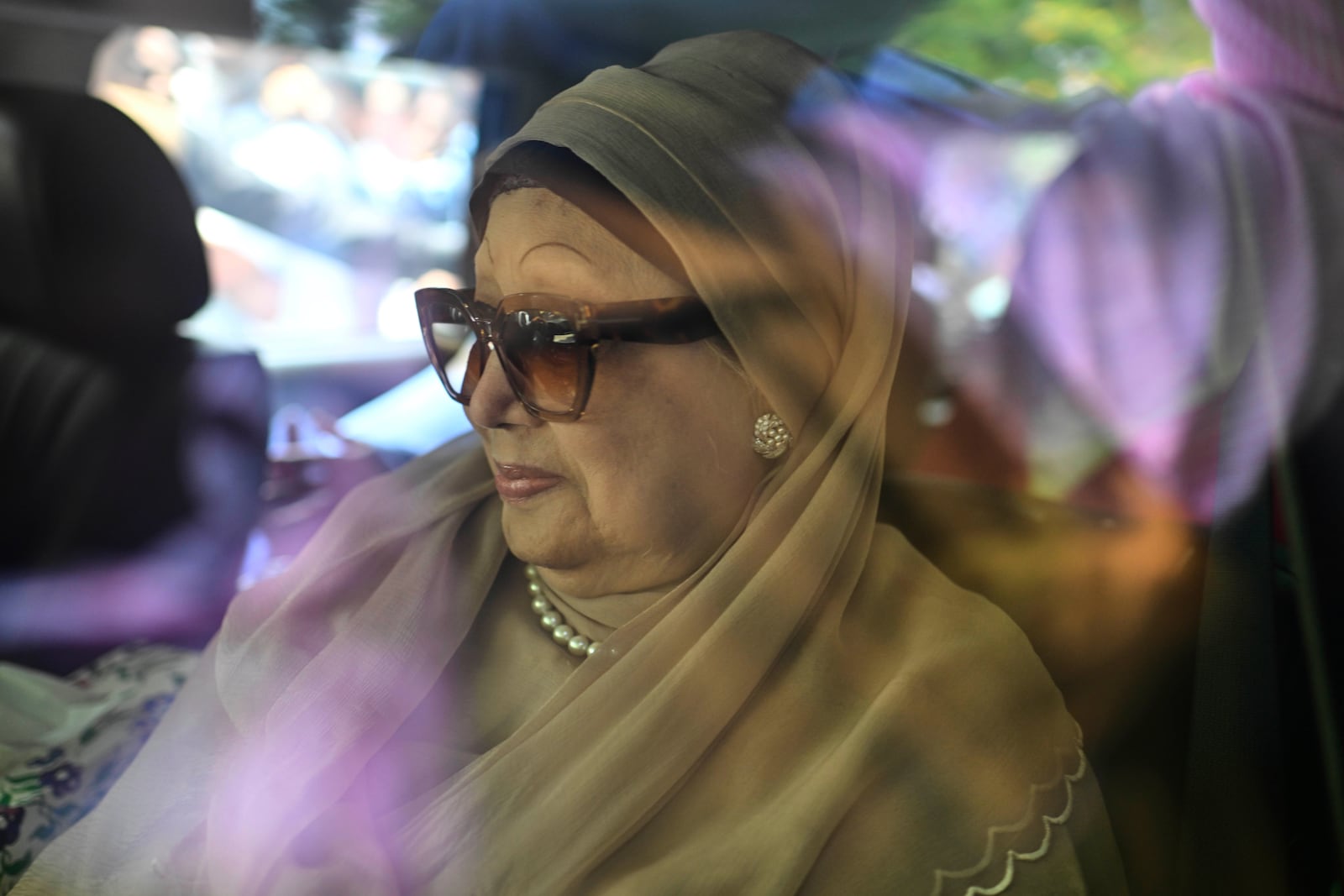 Bangladesh's ailing former Prime Minister Khaleda Zia leaves from airport in a car after she arrived from London, in Dhaka, Bangladesh, Tuesday, May 6, 2025. (AP Photo/Mahud Hossain Opu)