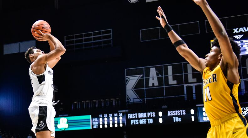 Lakota East’s Nate Johnson puts up a shot during their 47-33 loss to Moeller 47-33 in their Division I regional boys basketball semifinal Wednesday, March 13 at Xavier University’s Cintas Center in Cincinnati. NICK GRAHAM/STAFF