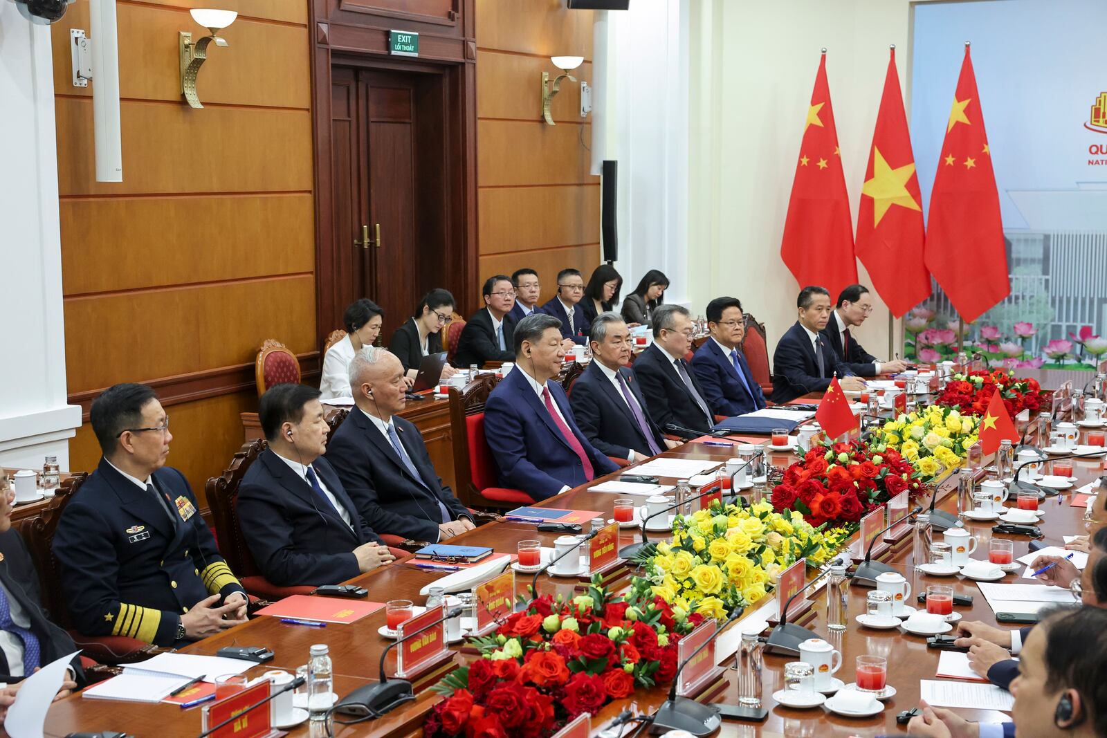 Chinese President Xi Jinping, centre, and Chinese Foreign Minister Wang Yi attend a meeting with Vietnam's National Assembly Chairman Tran Thanh Man during a two-day state visit, in Hanoi, Vietnam, Monday April 14, 2025. (Athit Perawongmetha/Pool Photo via AP)