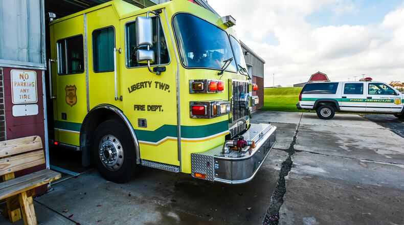 A crew with Liberty Township Fire Department responds to a call from their Yankee Road Station, the oldest of their three buildings, Wednesday, Nov. 30 in Liberty Township. NICK GRAHAM/STAFF