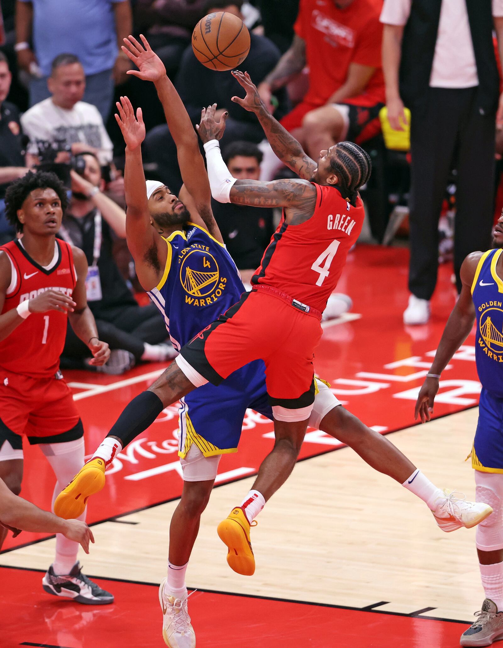 Golden State Warriors' Moses Moody (4) defends against Houston Rockets' Jalen Green (4) during the second half of Game 1 of an NBA basketball first-round playoff series in Houston, Sunday, April 20, 2025. (Scott Strazzante/San Francisco Chronicle via AP)