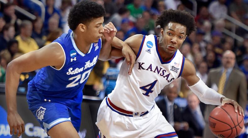 Kansas' Devonte Graham (4) battles his way by Seton Hall's Desi Rodriquez on his way to the bucket during the second half in the second round of the NCAA Tournament at Intrust Bank Arena in Wichita, Kan., on Saturday, March 17, 2018. KU advanced, 83-79. (Rich Sugg/Kansas City Star/TNS)