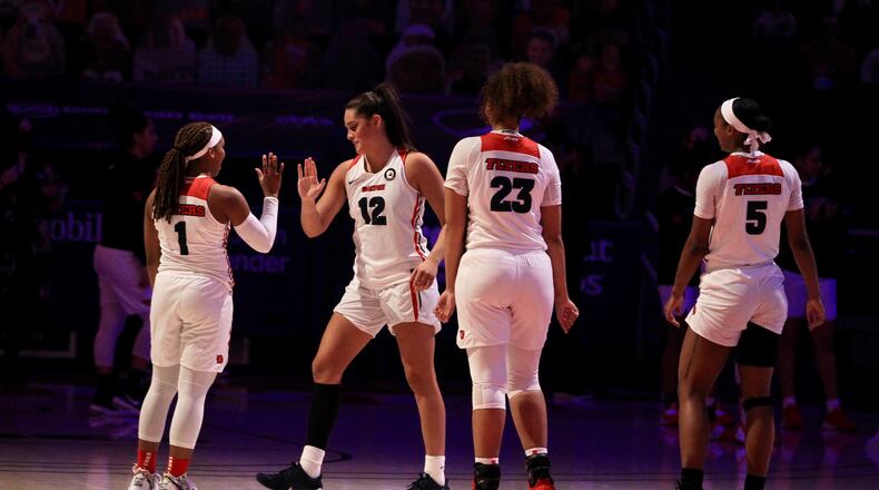 Dayton starters, including Jenna Giacone (12), are introduced before a game against Duquesne on Sunday, Jan. 3, 2020, at UD Arena. David Jablonski/Staff