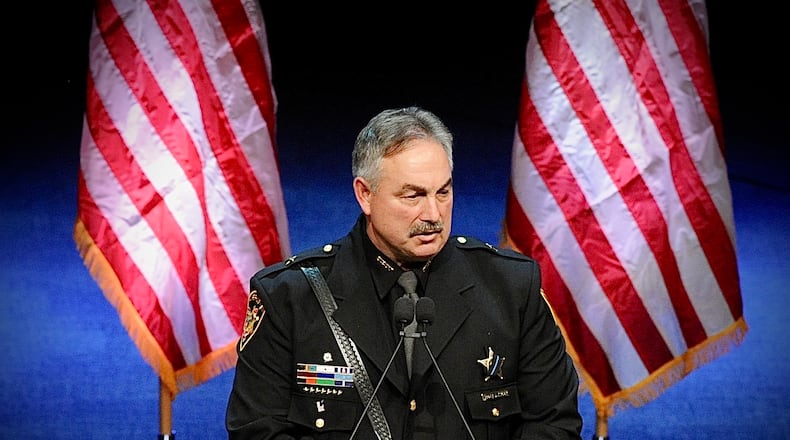 Greene County acting sheriff Scott Anger pays his respects at services for Greene County Sheriff Gene Fischer, who died Nov. 16, 2021.
