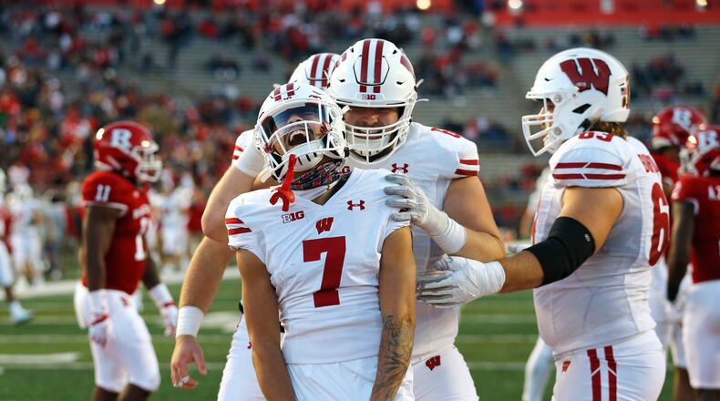 Wisconsin wide receiver Danny Davis III (7) reacts after scoring a touchdown against Rutgers during the second half of an NCAA college football game, Saturday, Nov. 6, 2021, in Piscataway, N.J. Wisconsin defeated Rutgers 52-3. (AP Photo/Noah K. Murray)