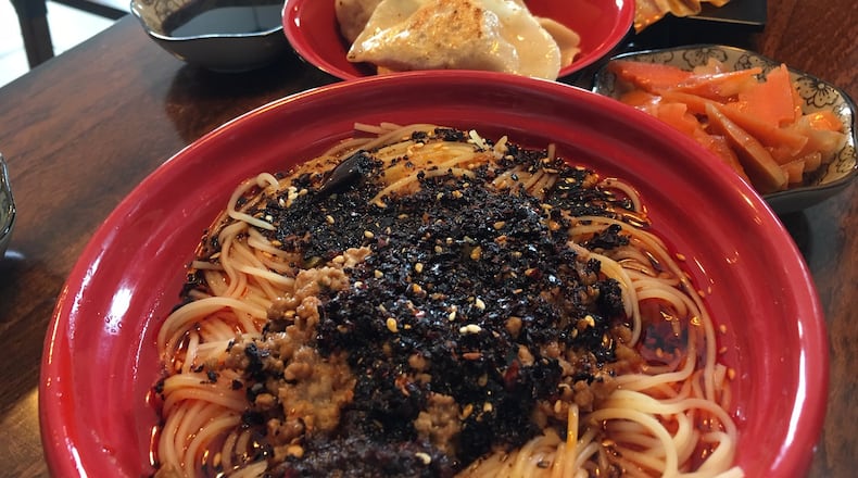 The Dan Dan noodles at Kung Fu Noodles feature kicky noodles mixed with fine ground pork, pickled long string beans, sesame paste and spicy garlic sauce. CONTRIBUTED/ALEXIS LARSEN