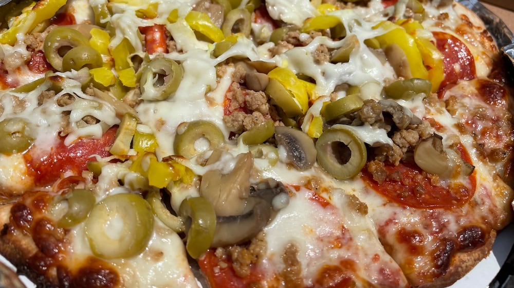 201 Tavern, a new restaurant serving pizza, subs and more, has opened in the former spot of Paisano’s Pizza Pub in the Old North Dayton neighborhood. NATALIE JONES/STAFF