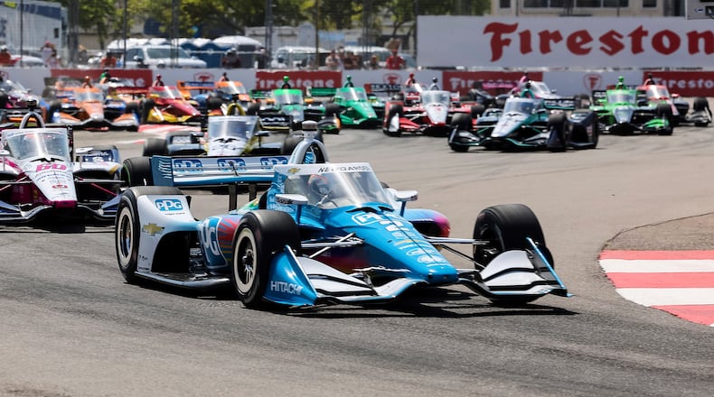 FILE - Josef Newgarden leads the pack into Turn 2 after the start of the IndyCar Grand Prix of St. Petersburg auto race, Sunday March 10, 2024, in St. Petersburg, Fla. (AP Photo/Mike Carlson, File)