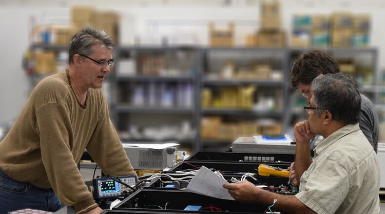 Cornerstone Research Group employees at work. Contributed.