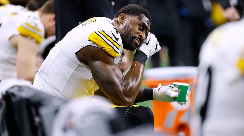 Pittsburgh Steelers' DK Metcalf wipes his face on the bench during the second half of an NFL football game against the Detroit Lions, Sunday, Dec. 21, 2025, in Detroit. (AP Photo/Rey Del Rio)
