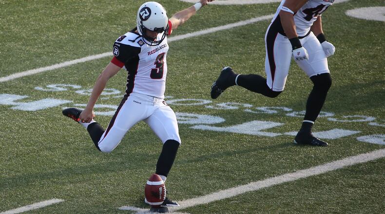 HAMILTON, CANADA - JULY 26: Brett Maher #3 of the Ottawa Redblacks kicks off to start the game during CFL game action against the Hamilton Tiger-Cats on July 26, 2014 at Ron Joyce Stadium in Hamilton, Ontario, Canada. (Photo by Tom Szczerbowski/Getty Images)