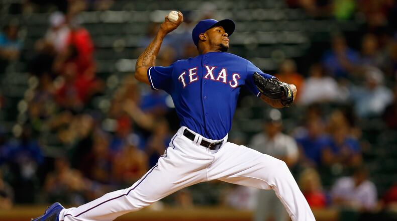 ARLINGTON, TX - SEPTEMBER 04: Lisalverto Bonilla #59 of the Texas Rangers pitches against the Seattle Mariners in the top of the seventh inning at Globe Life Park in Arlington on September 4, 2014 in Arlington, Texas. (Photo by Tom Pennington/Getty Images)