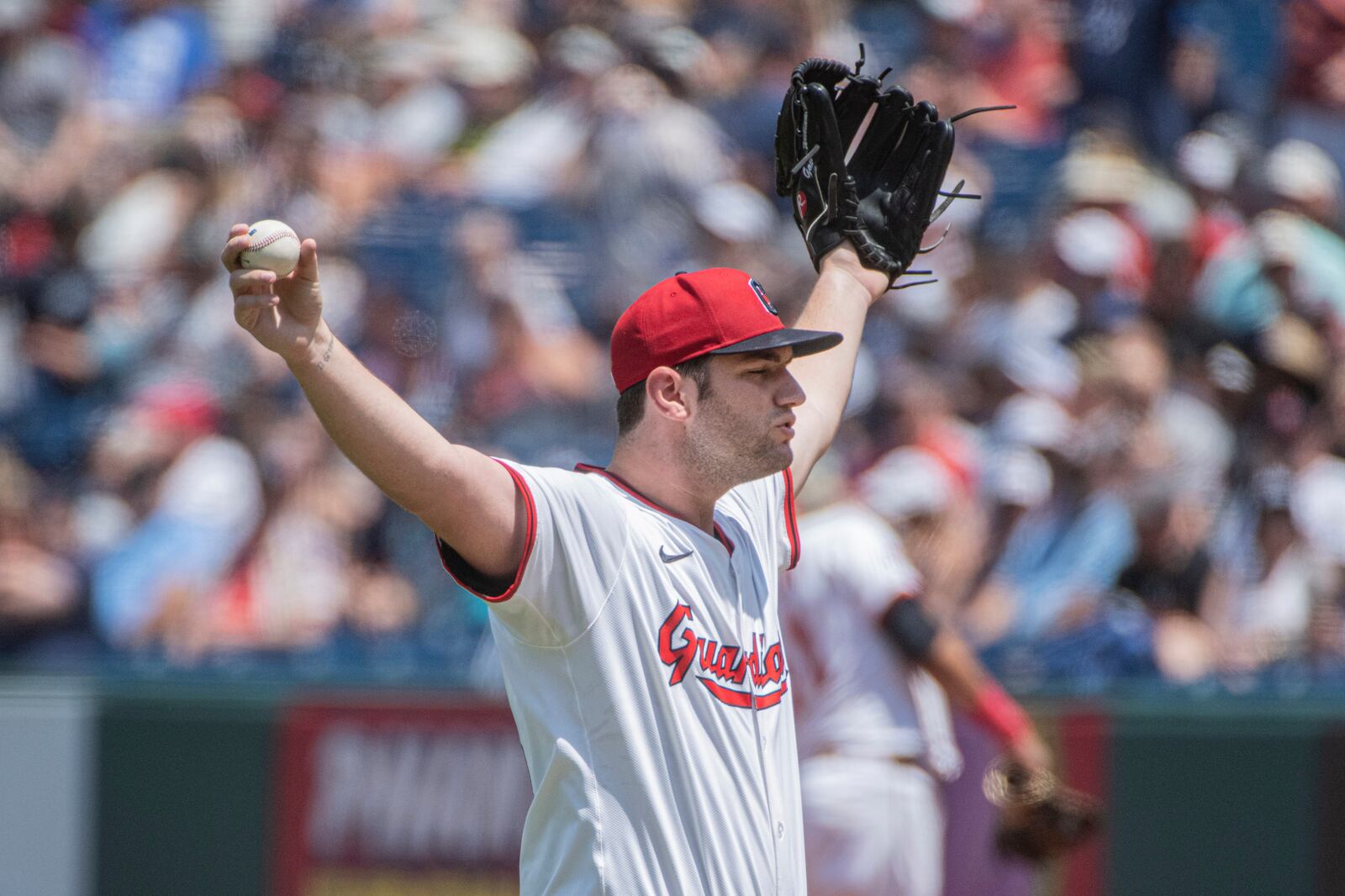 Cleveland Guardians starting pitcher Gavin Williams pauses between pitches during the first inning of a baseball game against the Detroit Tigers, Sunday, July 6, 2025, in Cleveland. (AP Photo/Phil Long)