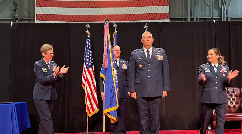 Col. Kenneth A. Stremmel, center front, took command of the National Air and Space intelligence Center at the National Museum of the U.S. Air Force Friday July 26. To Stremmel's right is Lt. Gen. Leah Lauderback, a former NASIC commander and deputy chief of staff for intelligence for the Air Force. To his left is Brig. Gen.-select Ariel Batungbacal, the former NASIC commander. THOMAS GNAU/STAFF