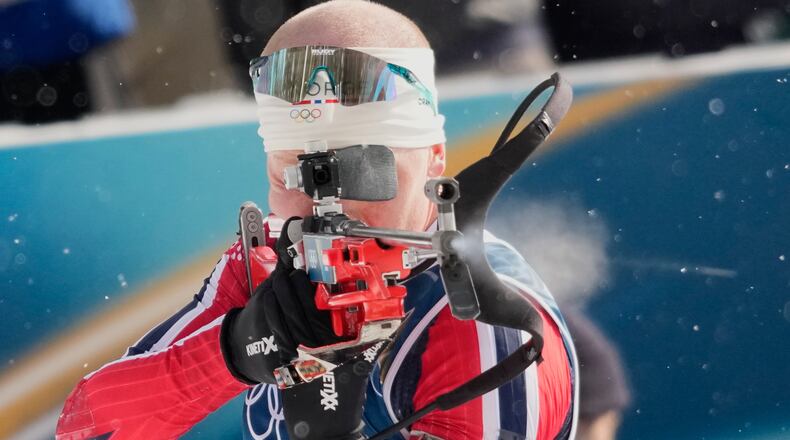 Norway's Johannes Dale-Skjevdal shoots during the men's biathlon 15-kilometers mass start race at the 2026 Winter Olympics, in Anterselva, Italy, Friday, Feb. 20, 2026. (AP Photo/David J. Phillip)