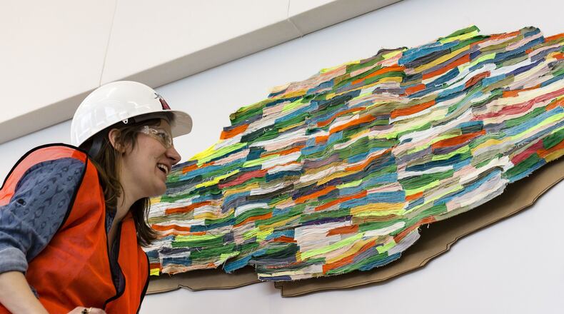 Artist Andrea Myers installs her work. CONTRIBUTED PHOTO BY ANDY SNOW
