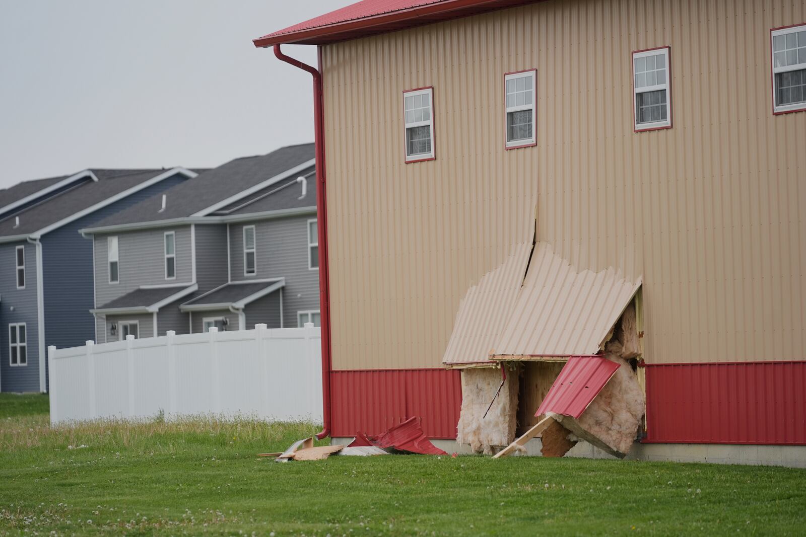Damage is visible at the scene after a car barreled through a building used for an after-school camp Tuesday, April 29, 2025, in Chatham, Ill. (AP Photo/Erin Hooley)