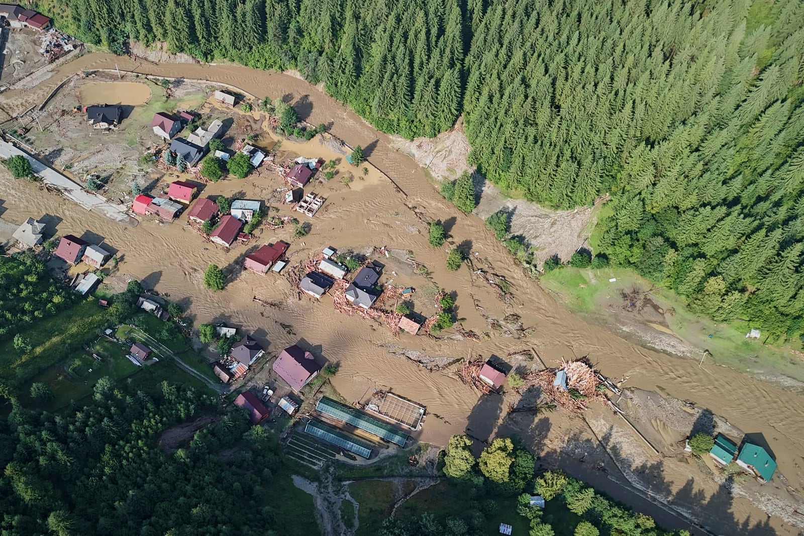 In this image released by the Romanian Emergency Services Suceava (ISU Suceava) damage from a flood is seen in the village of Brosteni, northern Romania, Monday, July 28, 2025. (Romanian Emergency Services - ISU Suceava via AP)
