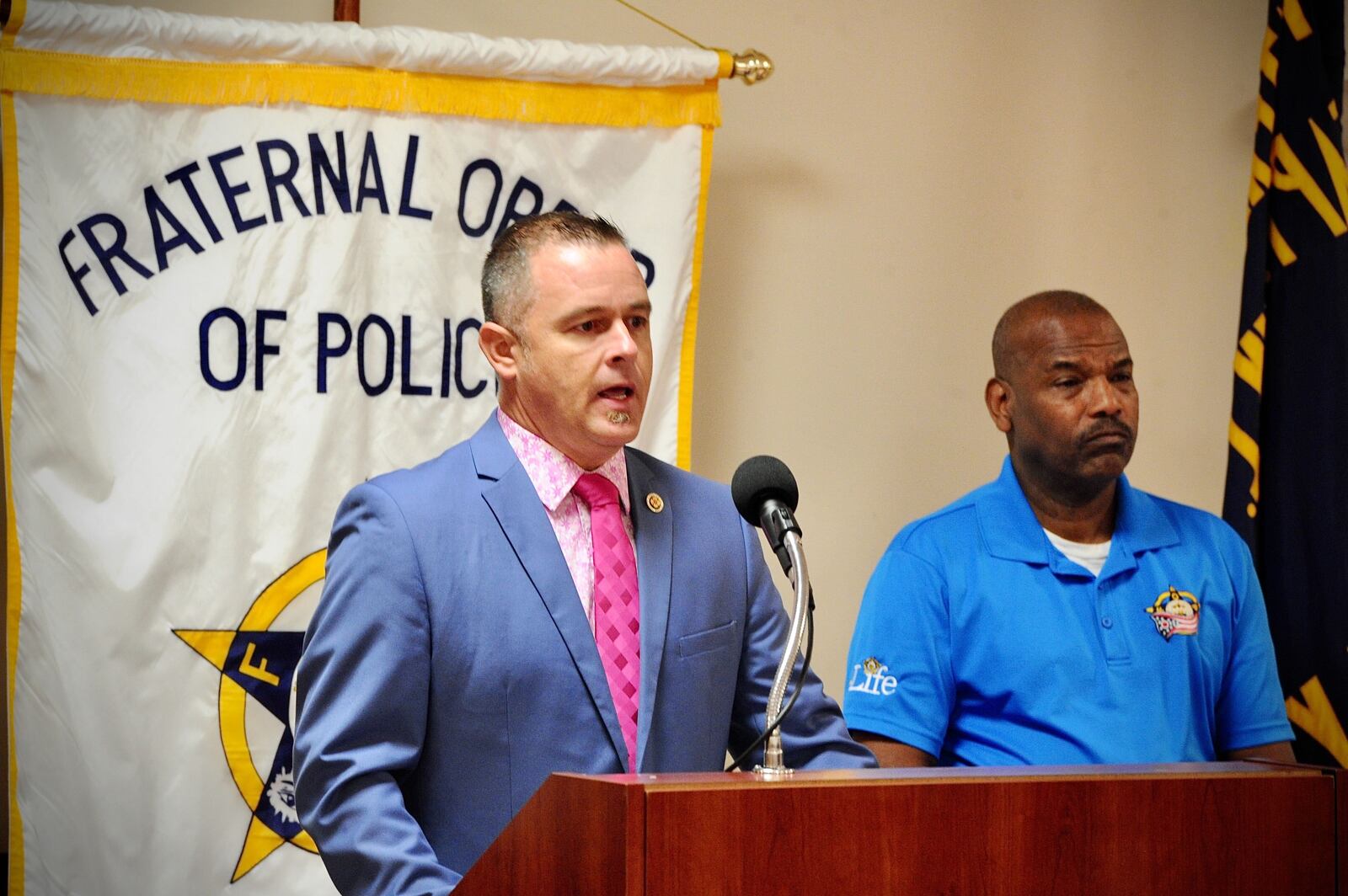Kraig Robinson, president of Dayton Fire Fighters, Local 136, left, and Deric McDonald, vice president of Fraternal Order of Police Local 44, spoke to the media Thursday, Oct. 28, 2021, to address what they called a looming crisis Involving the city’s vaccine/testing rules for workers. MARSHALL GORBY\STAFF