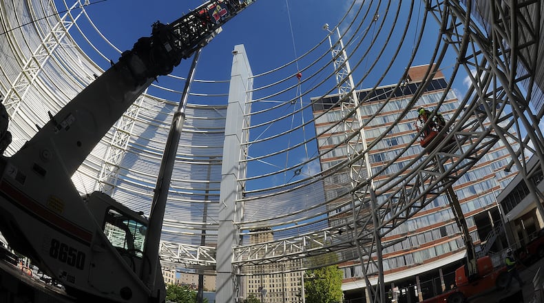 Demolition started early Tuesday morning Aug. 16, 2022 on the structure in front of the Dayton Convention Center. MARSHALL GORBY\STAFF