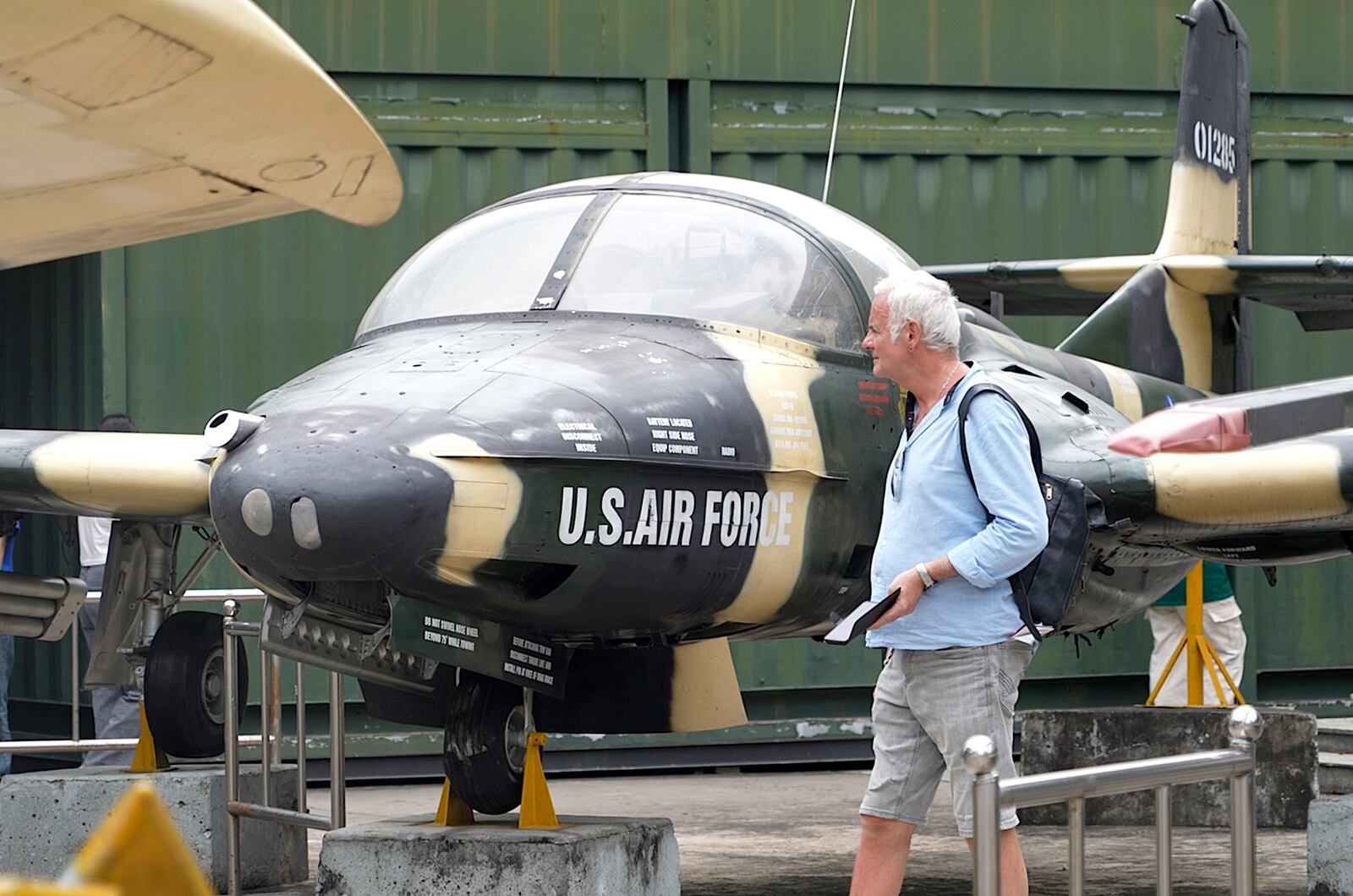 A tourist looks at a U.S Air Force fighter jet used during the Vietnam war on display at the War Remnants Museum in Ho Chi Minh City, Vietnam, Feb. 22, 2025. (AP Photo/Hau Dinh)