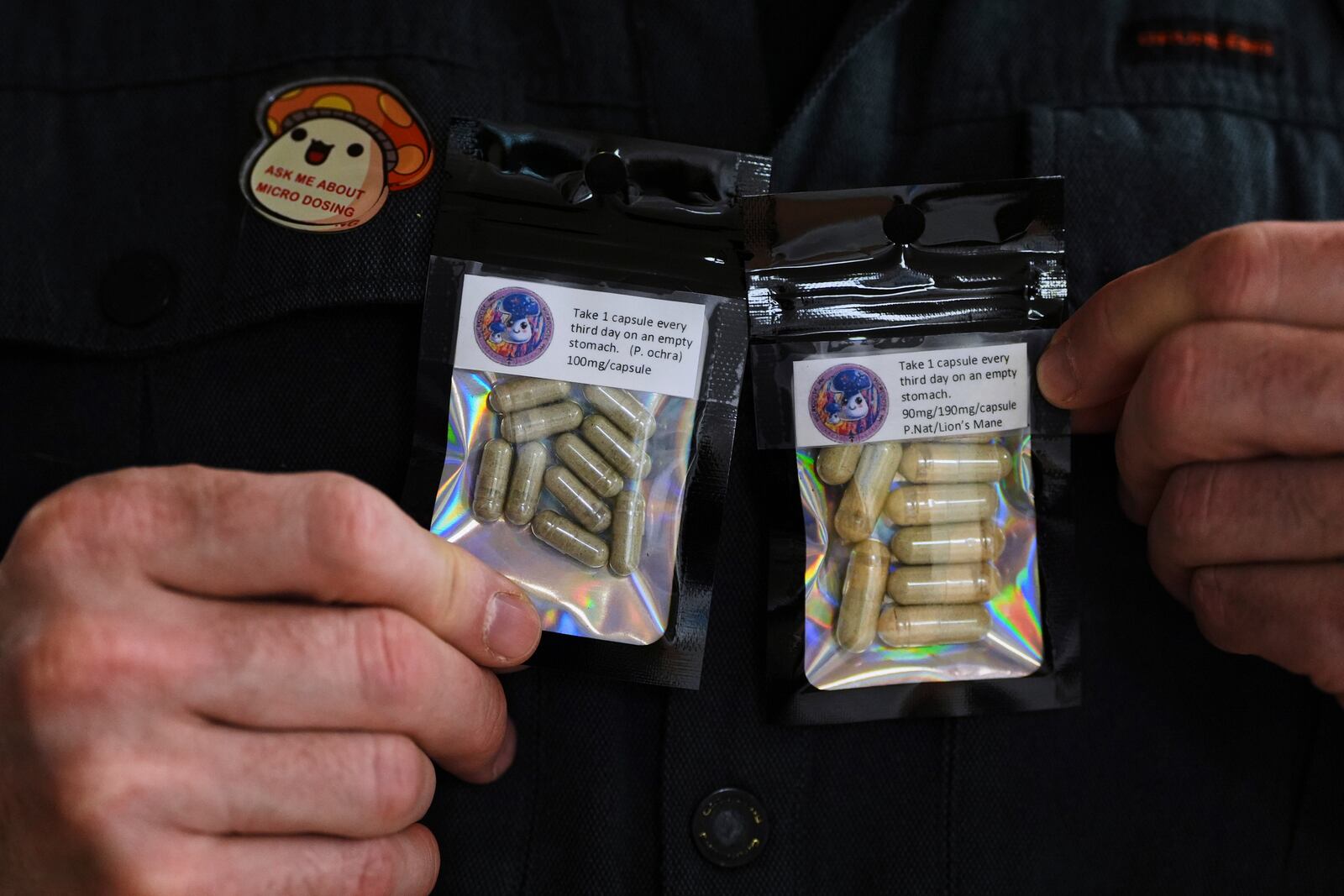 Marine Corps combat veteran Matt Metzger, who grows his own mushrooms for microdosing psilocybin, displays prepared doses in packets Wednesday, March 26, 2025, in Olympia, Wash. (AP Photo/Lindsey Wasson)